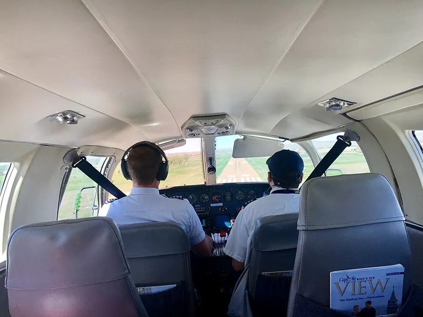 Cockpit view during an approach to L. M. Clayton Airport in Wolf Point, Montana