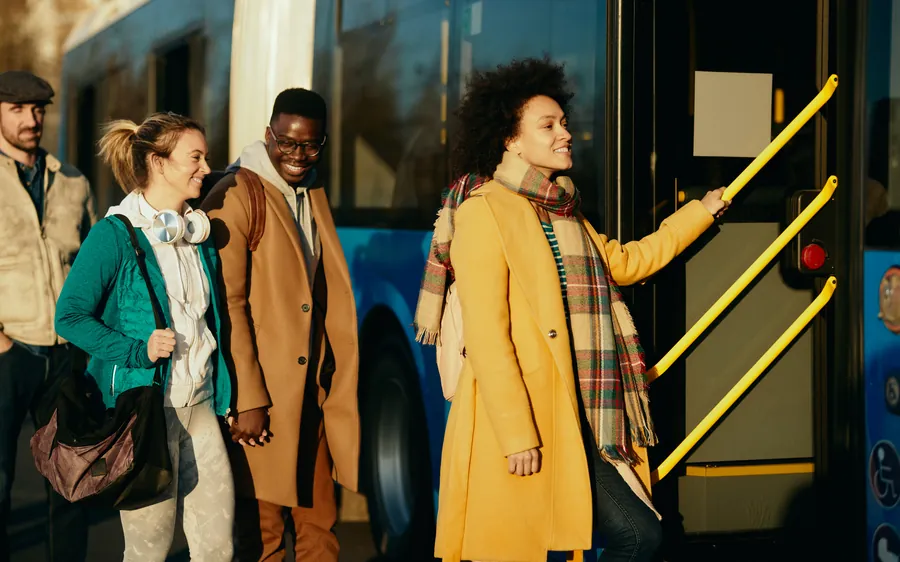 A happy group of travellers boarding together